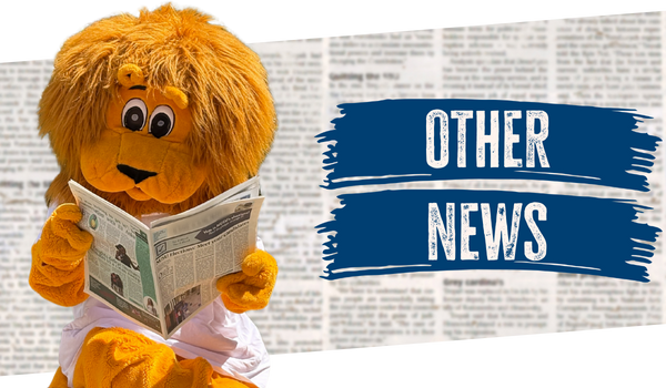 Image of Percy the lion reading a newspaper with text that reads Other news