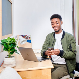 Student on their phone in accommodation